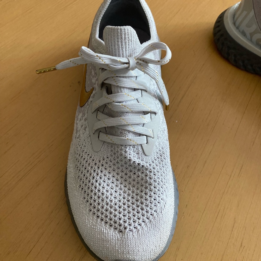 Nike epic react flyknit “vast gold” women’s sneakers